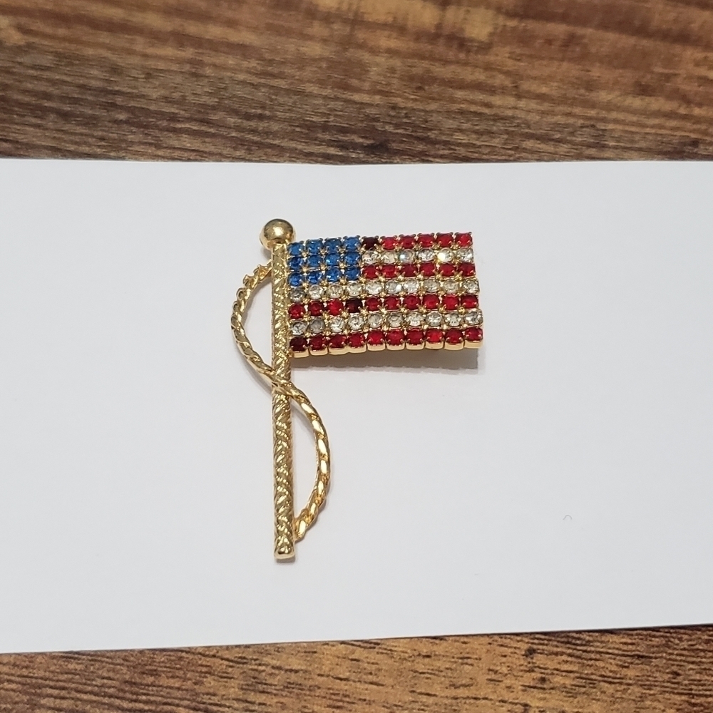 gold tone American flag brooch with gems